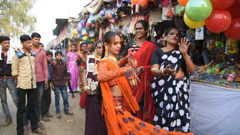 AMRAVATI, MAHARASHTRA, INDIA 22 JANUARY 2017 : Unidentified group hijra or transgenders dance and singing at street, It is a social category in the Indian society who recognizes third genders.