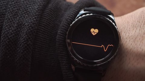 Lviv, Ukraine - January 2017: Smartwatch showing the heart rate to the user.