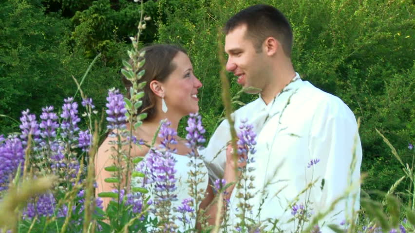 Model released bride and groom smiling on their wedding day during portrait
