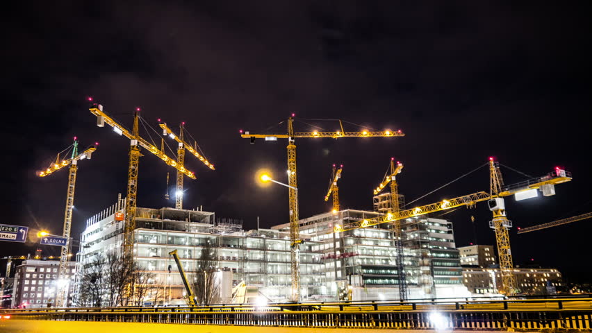 Construction site at night Time Lapse. Working tower cranes, buildings and traffic | Shutterstock HD Video #23419333
