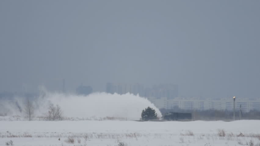 Snow thrower clears the runway, airport, Novosibirsk