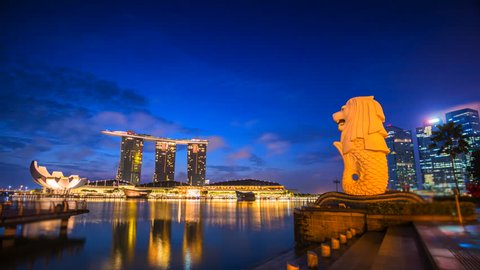 SINGAPORE - FEBRUARY 14: Time lapse Sunrise at Singapore city landmark Merlion The Merlion Statue with the City Skyline in the background, Marina Bay on February 14,2016 in Singapore 