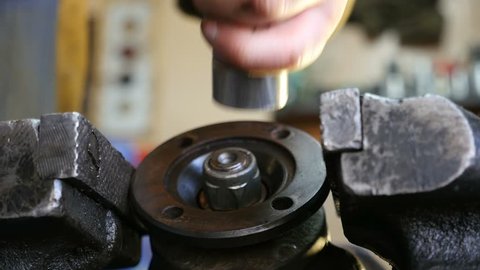  Mechanic repairing car gearbox, close-up
