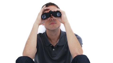 A sitting man is looking through binoculars against a white background