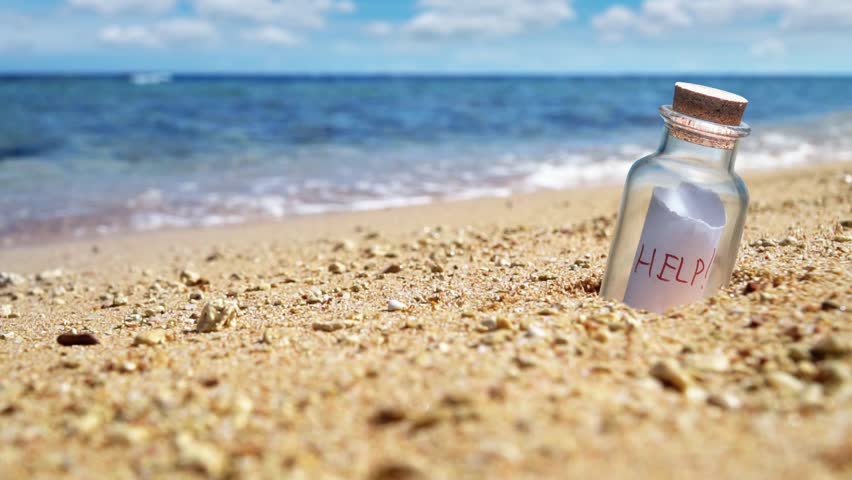 Help request in a bottle on the beach. Slow motion.