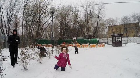 Snow battle with three children and adult at winter day, FPV, slow motion