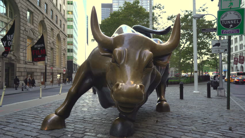 Charging bull sculpture slider shot - October 2016. Manhattan, New York city, United States