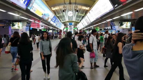 BANGKOK,THAILAND- JAN 26,2017: Crowd getting in and out of the train at Siam BTS station, the busiest station of Bangkok's aerial Metro. The Bangkok Mass Transit System, commonly known as the Skytrain