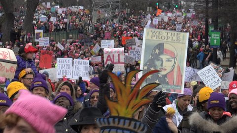 WASHINGTON, DC - JAN. 21, 2017: This is What Democracy Looks Like chant as marchers arrive with banners, part of gigantic turnout that flooded DC in the anti-inauguration Women's March on Washington.