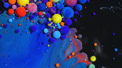 Multicolored Bubbles Of Bright Collors Moving In Paint Oil Surface Beautiful Blue Universe Of Color Slow Motion Macro Red Blue Black And Yellow. Stock-video