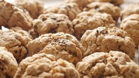 Chocolate chip cookies on pile close-up 4K 2160p 30fps UHD tilting footage - Tasty homemade biscuits with oatmeal served on plate shallow DOF slow tilt 3840X2160 UltraHD video