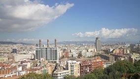 4k beautiful timelapse time lapse clouds passing over busy modern city Barcelona sunny day building construction aerial