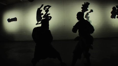 Two Shaolin monks practice their ancient form of hand-to-hand kung fu.