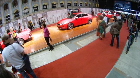MOSCOW - APR 8: (Timelapse View) People are photographed with Volvo cars at exhibition VOLVO - Week of fashion in Moscow in Gostini dvor, on April 8, 2012 in Moscow, Russia Editorial Stock Video