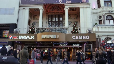 LONDON, ENGLAND - December 21: Centre London Cinema and Shopping Street in Leicester Square Theatreland in London People Walk Visit ( Ultra High Definition, Ultra HD, UHD, 4K, real time )
