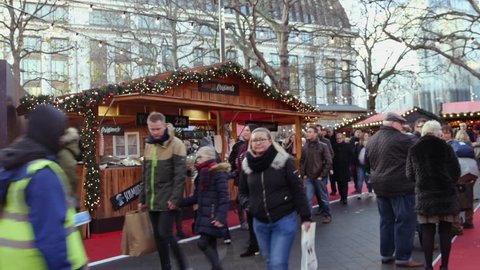 LONDON, ENGLAND - December 21: Chrismas Market and Shopping Street in Leicester Square Theatreland in London People Walk Visit ( Ultra High Definition, Ultra HD, UHD, 4K, real time )