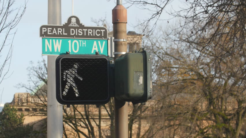 Pedestrian crossing at NW10th Avenue. Pearl District, Portland, Oregon. The area has undergone significant urban renewal since the mid 1980s where it was reclassified as mixed use from industrial.

