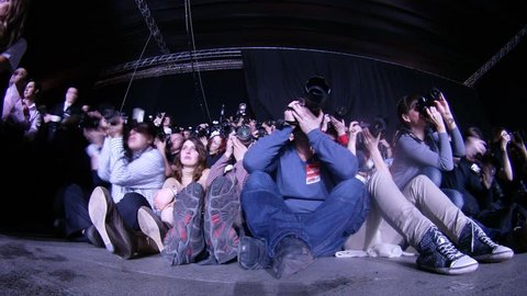 MOSCOW - APR 8: (Timelapse View) Many photographers photograph fashion show sitting on floor on VOLVO - Week of fashion in Moscow in Gostini dvor, on April 8, 2012 in Moscow, Russia Editorial Stock Video