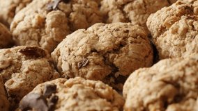 Slow pan on homemade chocolate chip cookies pile close-up 4K 2160p 30fps UHD  footage - Shallow DOF oatmeal biscuits served on plate 3840X2160 UltraHD panning video