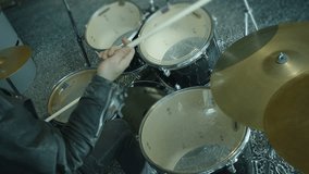 Drummer playing on drum set.  Shot on RED HELIUM cinema camera in slow motion 4K.