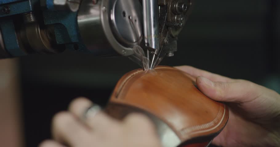 Slow motion close up shot of shoe making by hand.  Royalty-Free Stock Footage #23490529