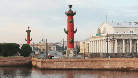 Russia, Saint-Petersburg, 29 June 2016:  The Vasilievskiy Island at sunrise, Rostral Columns, Isaacs Cathedral, Golden Dome,  Admiralty, Palace Bridge, water reflections, Winter Palace, Hermitage