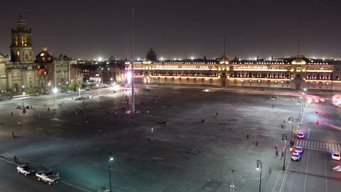 time-lapse of the zocalo in mexico city, with the cathedral at night 