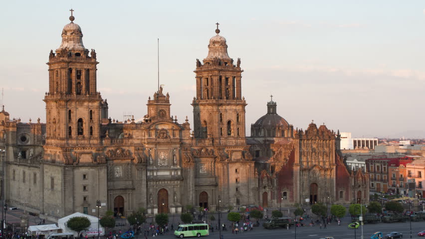 time-lapse of the zocalo in mexico city, with the cathedral and giant flag in the centre