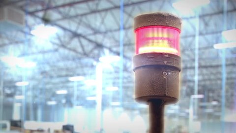 Red Siren in a Factory. Flashing Red Lamp on a Machine. Close-Up. 