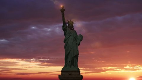 The Statue of Liberty, Sunrise Time Lapse. Sunbeam lights the torch of the statue of liberty. Animation.