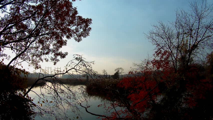 eautiful landscape with sunset over the river and rippling water. Gradient blue, purple and yellow