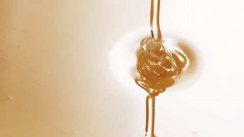 honey pour from spoon in slow motion, 180fps prores footage