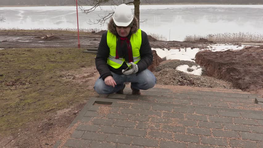 Construction engineer take pictures of pavement
