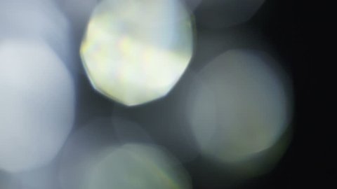 Abstract defocused crystal elements on black background. This footage can be used on first plan of different videos by blend modes Overlay or Screen. Shot on RED cinema camera . 4K