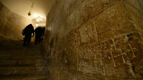JERUSALEM, ISRAEL - 27th DECEMBER 2016: Crusader graffiti carved in stairs walls leading to Chapel of Saint Helene, Church of Holy Sepulchre, Jerusalem, Israel.