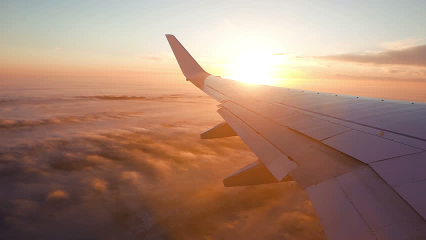 Aerial view of sunrise through airliner window | Shutterstock HD Video #23524966