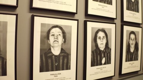 OSWIENCIM, POLAND - JANUARY, 14, 2017 Portraits of Auschwitz Birkenau female victims. German Nazi concentration and extermination camp. 4K steadicam video