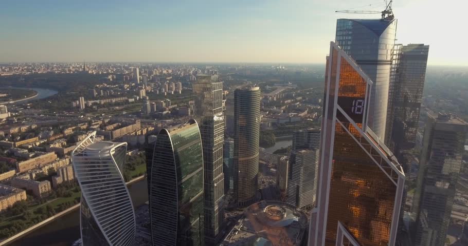 Business center Moscow City, aerial photography on the drone. Skyscrapers of glass and concrete in Moscow. Business center in the summer sun and surrounded by greenery. Kutuzovsky Prospect and Moscow | Shutterstock HD Video #23528569