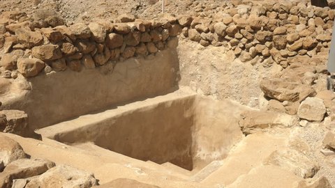 zoom in shot of a ritual bath at qumran near the dead sea, israel