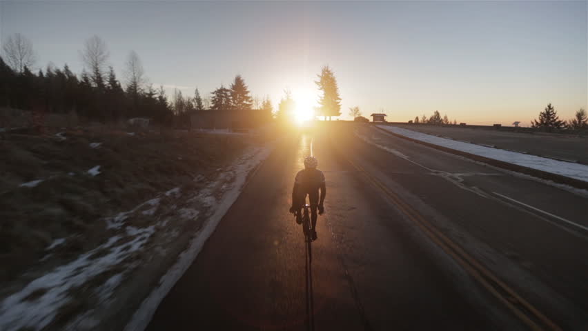 Man Cycling Up Mountain in Winter in Vancouver