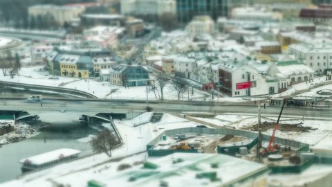 Streets of Minsk, Belarus winter. Car and people move quickly. Titelapse tilt shift
