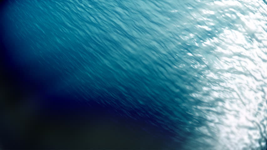 Underwater scene rotating camera,sunbeams shining through water's surface