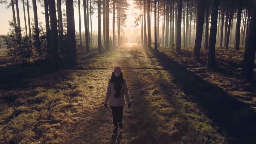 girl walking in woods