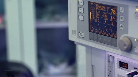 Close-up shot of a patient cardiac monitor working on anesthesia machine during surgery in hospital operating room.Patient monitoring equipment, ECG, cardiovascular monitor, heart rate. ICU. Emergency