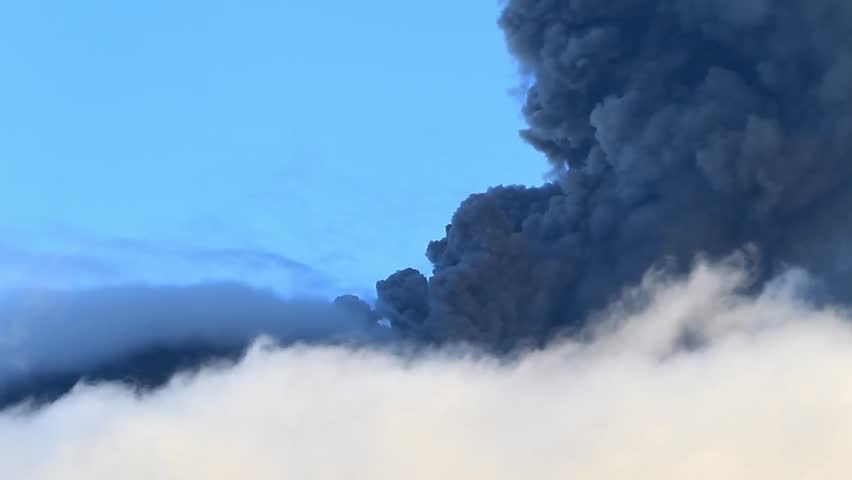 Tungurahua volcano in Ecuador, high presure gases and ash is blown into the sky.