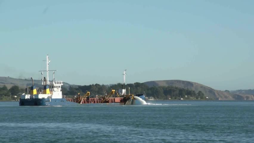 Otago Harbour, New Zealand, May 2012 -  Ship dredging the main shipping channel