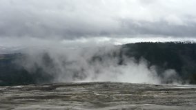Zooming timelapse of a smoking geyser at the top of mammoth hot springs, in Yellowstone national park, in Wyoming, United states of america.