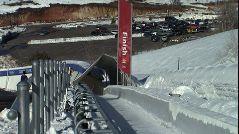 PARK CITY, UT - CIRCA 2004: Bobsled coming into finish line in Park City winter olympics complex.