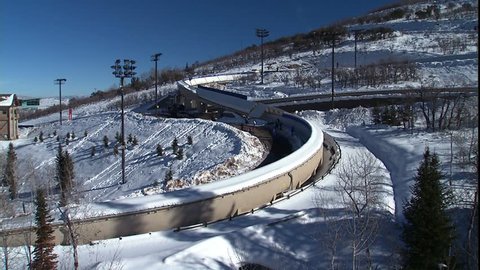 Olympic park with luge in foreground.