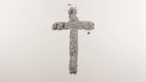 Creation of christian cross, crucifix made of ash as the concept of religion, Ash wednesday, resurrection and Easter